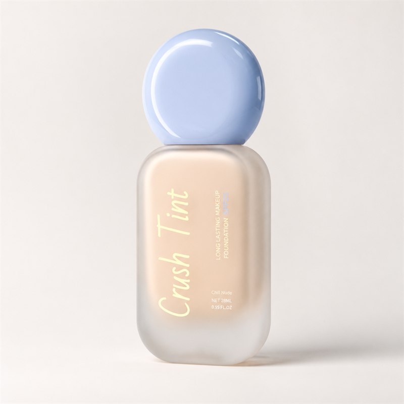 Crush Tint foundation bottle, front view, frosted glass with a pale blue sphere cap